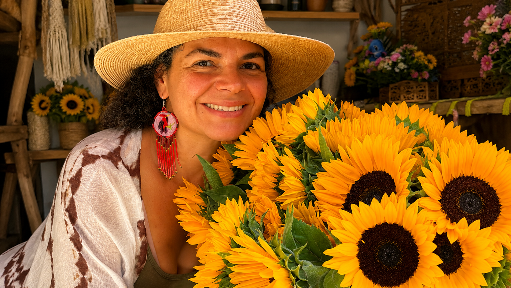 Malin holding a bouquet of sunflowers